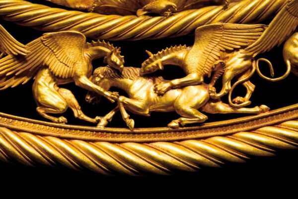 Detail from a golden Scythian pectoral from the royal grave in the Tolstaja Mogila Kurgan, middle of 4th century BCE. Museum of Historical Treasures of Ukraine, Kiev. Image released to the press in 2009. The Scythians were an ancient Iranian people of horse-riding nomadic pastoralists who throughout Classical Antiquity dominated the Pontic-Caspian steppe, known at the time as Scythia. By Late Antiquity the closely-related Sarmatians came to dominate the Scythians in the west. (Photo by: Pictures From History/Universal Images Group via Getty Images)