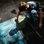 Photo: A boy draws a yellow and blue flag Source: Volodymyr Zelensky's Facebook