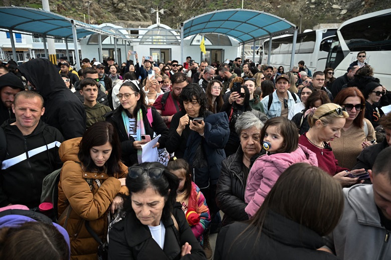 Habitants of Santorini gather in the port of Athinios